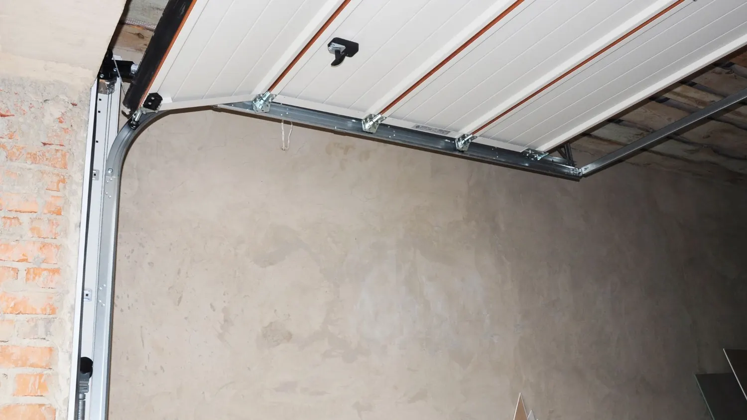 Garage door track being realigned in Buda, TX