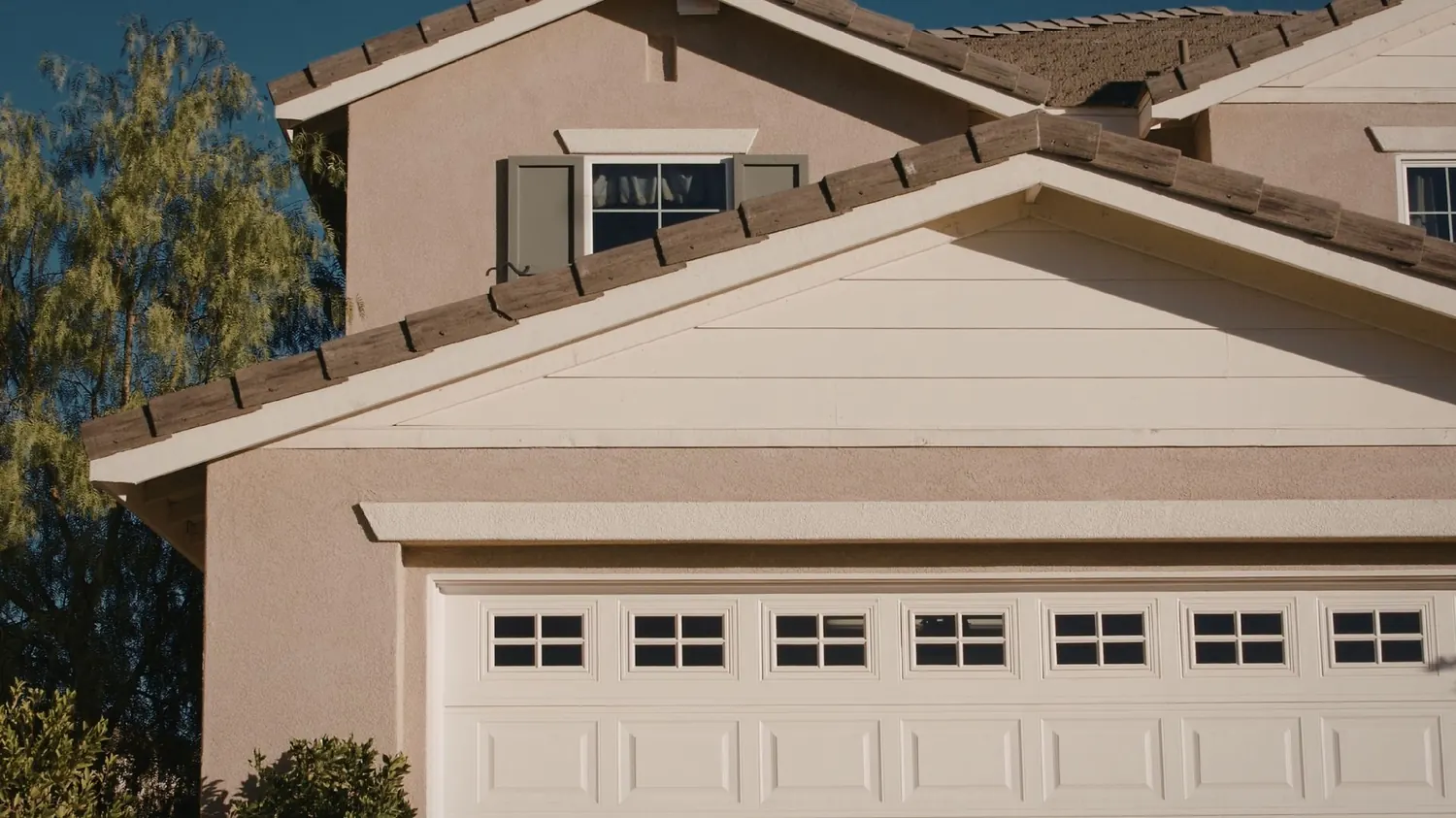 Garage door repair at a home exterior in New Braunfels, TX